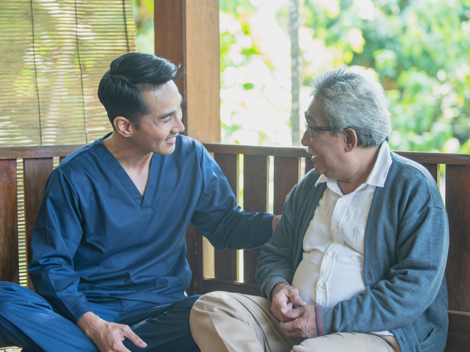 Professional caregiver supporting a client at home